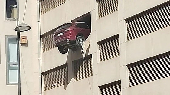 Lucky escape for driver as car left precariously dangling from third floor of building in Ibiza