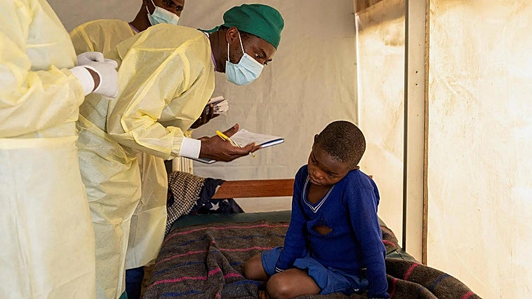 A doctor examines a child with mpox in the Democratic Republic of Congo.