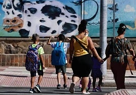 Mothers accompanying their children to school.