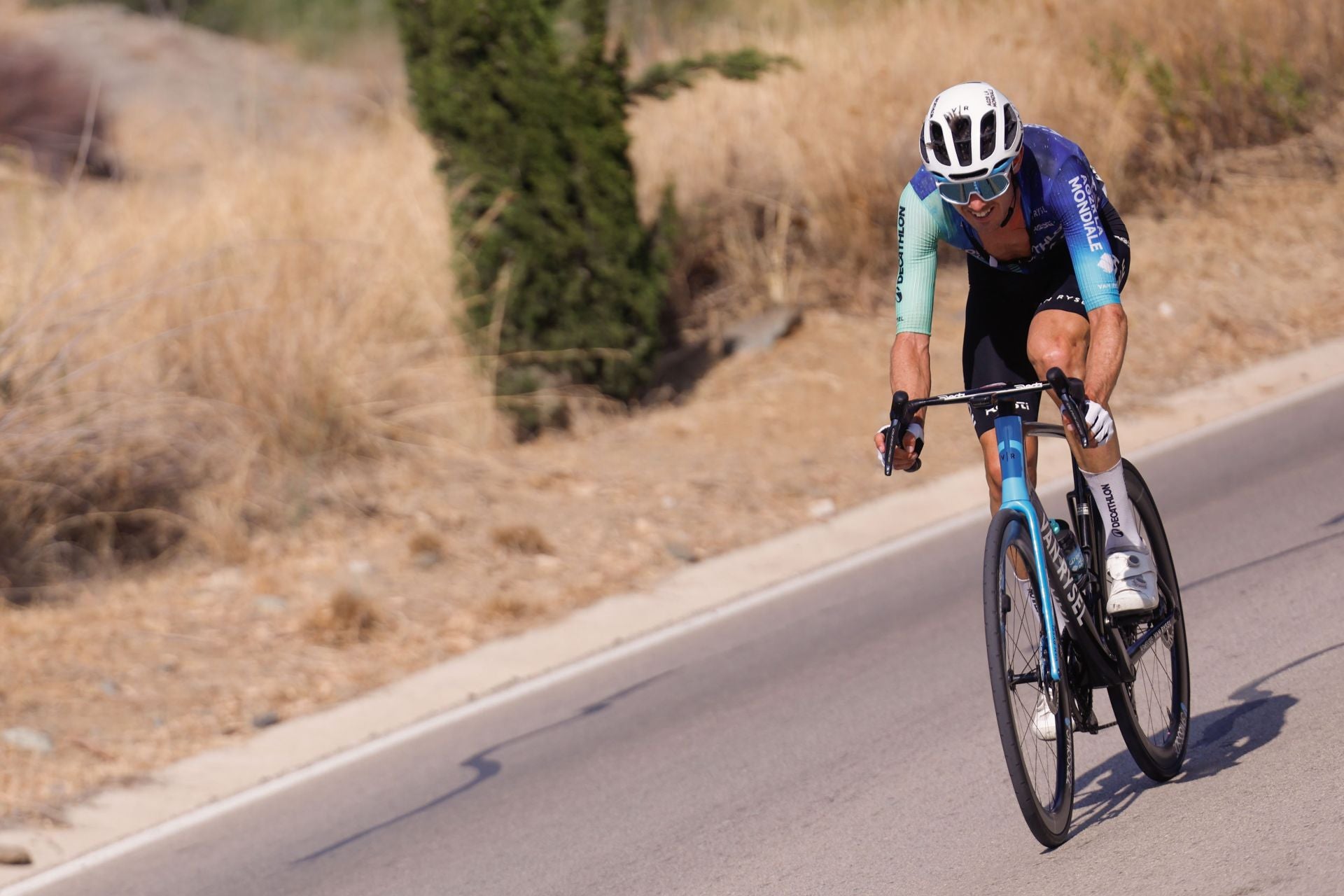 Vuelta a España pro cycle event races through inland Malaga towns and villages, in photos
