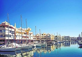 Sailboats moored in front of the houses in Puerto Marina in Benalmádena