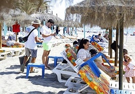A sunbed attendant at work on the Costa del Sol.