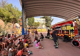 File image of a fire brigade demonstration on the covered sports court at the El Tejar school.