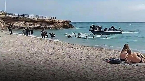 Migrants who arrived by boat on Costa del Sol beach taken to Red Cross centres in Malaga and Algeciras