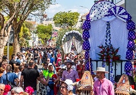 The colourful procession winds its way through the town centre.