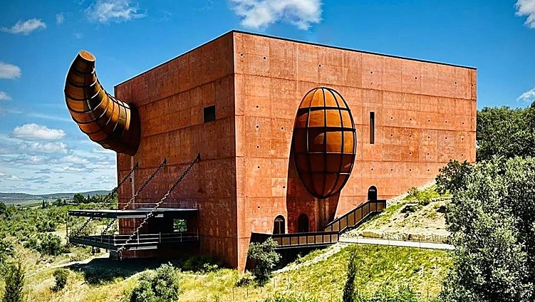 When will the designer Philippe Starck's striking organic olive oil experience open in Ronda?
