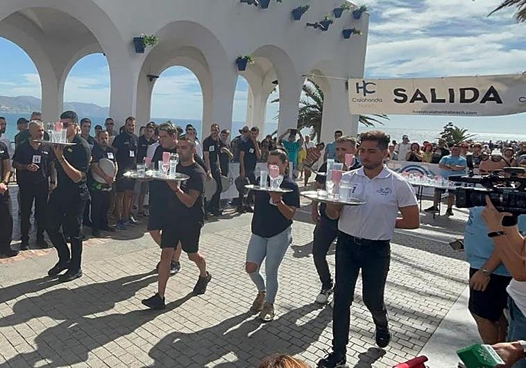Watch as waiting staff race around iconic Costa del Sol landmark to win big cash prizes