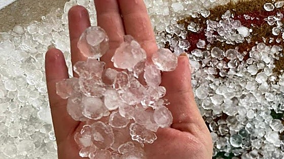 Hail stones the size of small coins pound homes and crops in Malaga province town