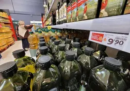 Bottles of olive oil in a supermarket.