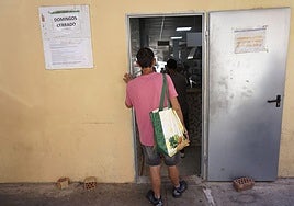 A person attending a soup kitchen in Malaga.