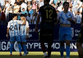 Julen Lobete, left, consoles Antoñito following his late miss.