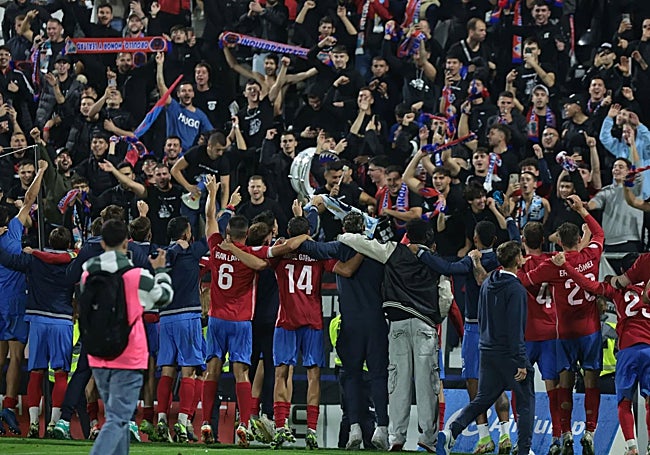 The Estepona players joined their fans in celebration after the final whistle.