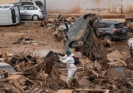 A worker in the midst of the devastation in Alfafar.