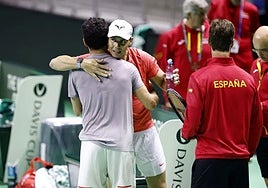 Nadal hugs teammate Roberto Bautista ahead of training on Friday.