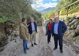 Marmolejo, Martínez, Salado and Lobo near the riverbed that overflowed