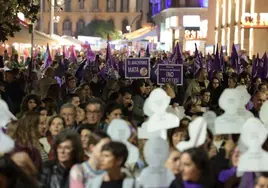 Protesters march through the streets of Malaga city