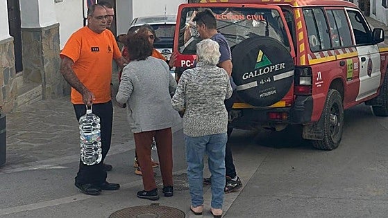 White village but murky waters: bottled water is delivered to Gaucin residents post-floods