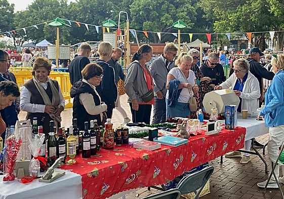 Visitors enjoy the market stalls.
