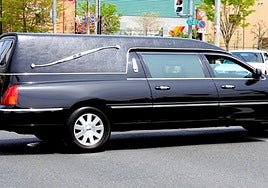 File image of a hearse being driven along a street.