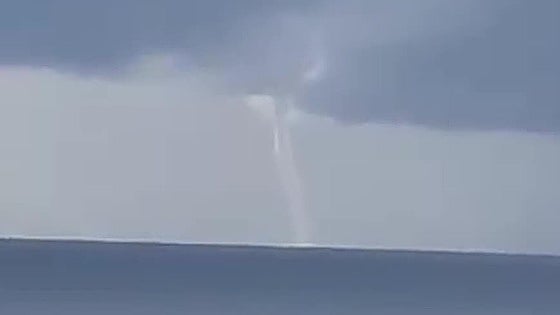 This is the moment an impressive waterspout whipped up the sea between two popular holiday resorts on the Costa del Sol