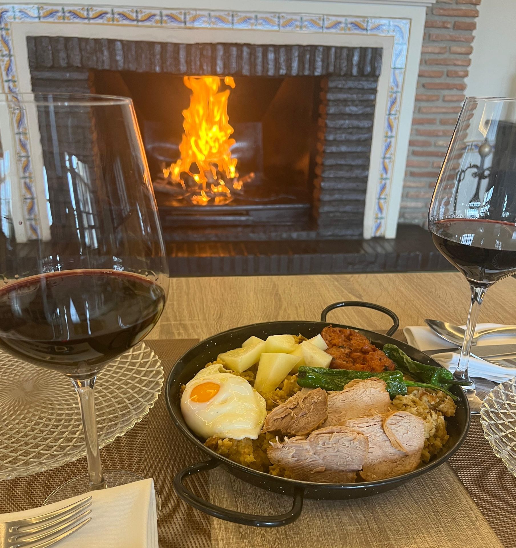 Migas by the fireplace at the legendary La Yedra venta.