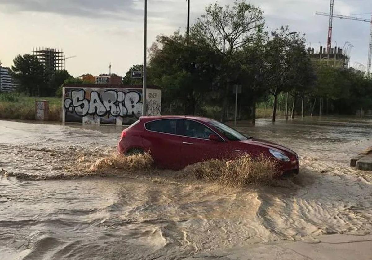 File image of a car beng driven along a flooded road in Murcia.