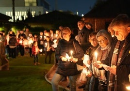 People lit candles in memory of loved ones.