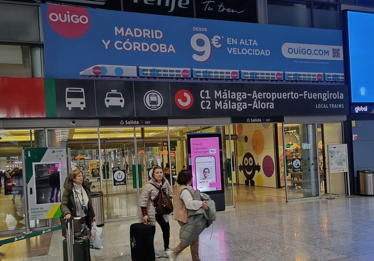 Ouigo billboard on the platform entrance at María Zambrano station in Malaga, offering train tickets to the Spanish capital from just nine euros.