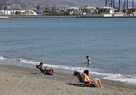 People sunbathing on the beach in Malaga