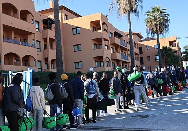 Migrants outside the hotel in Benahavís.
