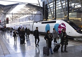 Rail passengers walk past the first Ouigo train this week at María Zambrano station in Malaga.