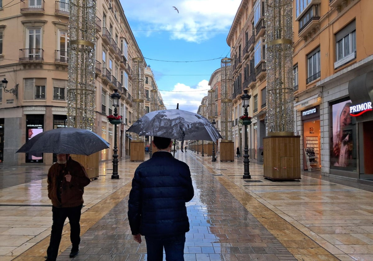 Open umbrellas on Calle Larios in Malaga.