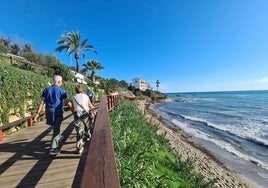 Foreigners strolling along the Mijas coastline.