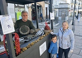 Juan and Isabel, along with their grandson Yeray, at their chestnut stall in central Ronda.
