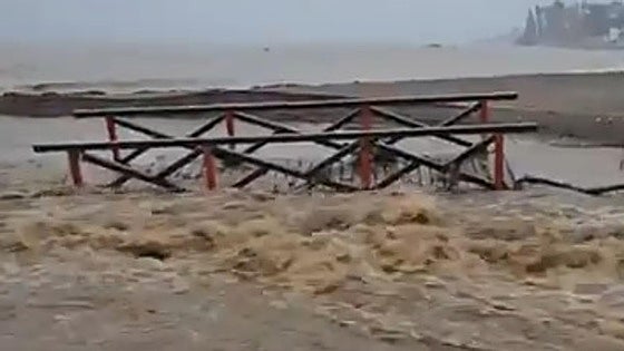 Watch as Costa del Sol footbridge is swept away by torrent of water from flooded stream in Mijas