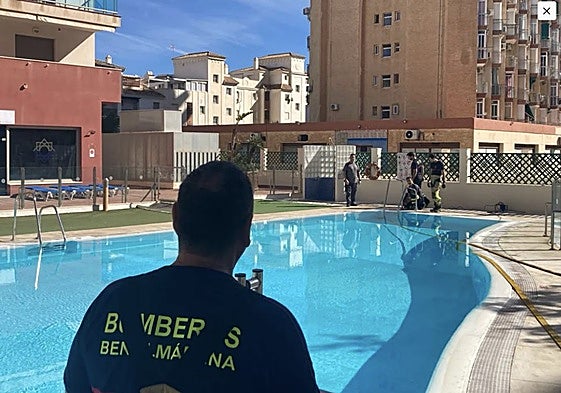 Municipal workers empty one of the swimming pools.
