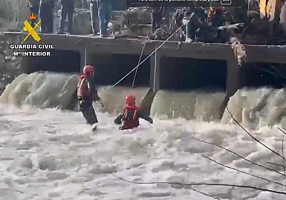 Police divers search for the missing motorcyclist.