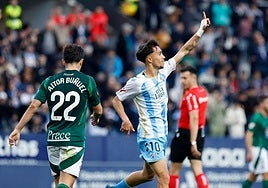 David Larrubia celebrates scoring Malaga's decisive second goal.