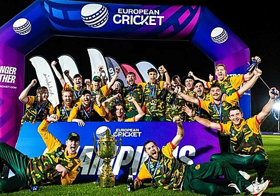 The victorious Farmers players pose with the trophy.