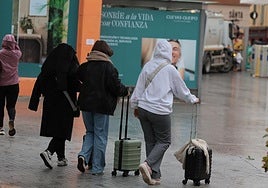 File image of tourists braving the rain.