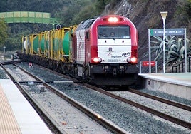 A freight train heads through Jimera de Libar on the Bobadilla-Algeciras railway line.