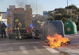 Firefighters extinguish the fire caused by the detained man.