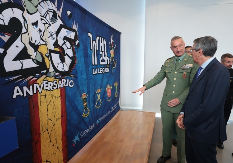 Francisco Salado and Fernando Sánchez look at this year's poster.