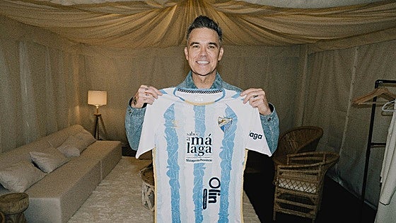 Popstar Robbie Williams rocks Malaga CF shirt on city visit