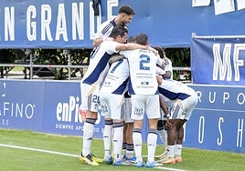 The Marbella players celebrate one of their first-half goals.
