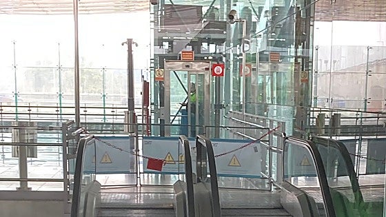 Why have all the escalators at Malaga Airport's train station ground to a halt?
