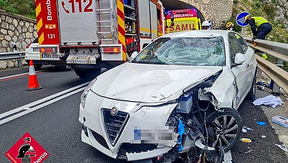 Man dies and his 14-year-old son is injured after car crashes into group of cyclists on main road in Spain