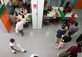 Civil servants at work in one of the region's employment service offices in Malaga.