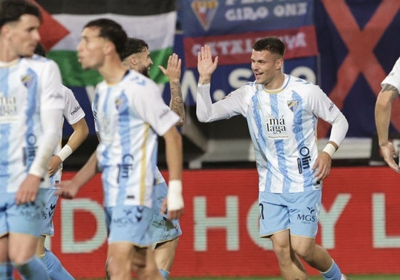 Malaga academy product Rafa celebrates putting his side 2-1 ahead.
