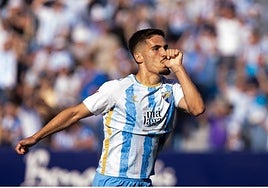 Malaga forward Chupete celebrates giving his side a first-half lead.